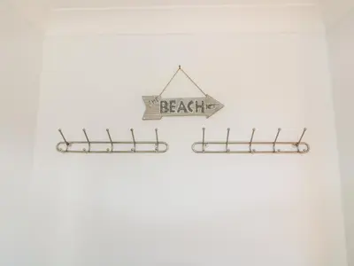 a beagle sign hanging on a wall at Carpe Diem in Crantock