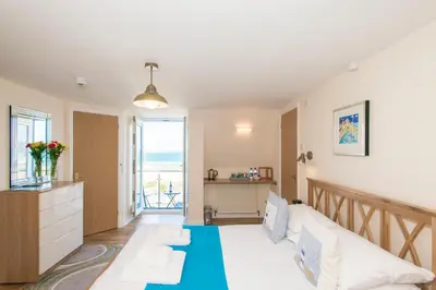 a living room with a couch and a table at The Penellen guest accommodation room only in Hayle