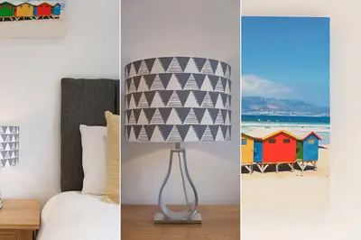 a lamp in a bedroom next to a bed at Tara in St Ives