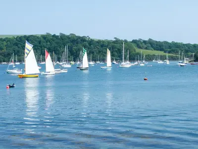 a group of sailboats on a large body of water at Stones Throw in Saint Mawes