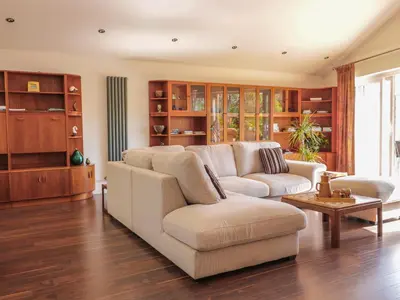 a living room with a couch and a table at Chy Lagen Hos in Newquay