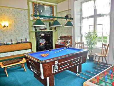 a living room with a pool table in it at WE ARE UNIQUE ! 4 min walk to Beach, Pubs, Restaurants, Shops, Htd Pool, Hottub, Games rm, 1 acre Garden, BBQ's Coast to Coast cycle path, Beautiful, Bassets acre, Only six 1-3 bedroom SUPERB apartments, Free Parking and WIFI in Portreath