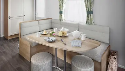 a table with food on top of a bench at Par Sands Coastal Holiday park in Par