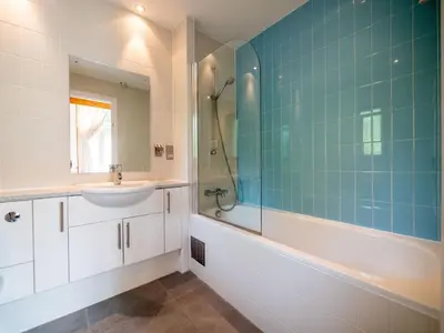 a bathroom with a sink and a tub and a shower at Holiday Home Villa Gallery by Interhome in Perranwell