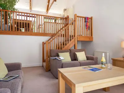 a living room with two couches and a table at Holiday Home Villa Gallery by Interhome in Perranwell