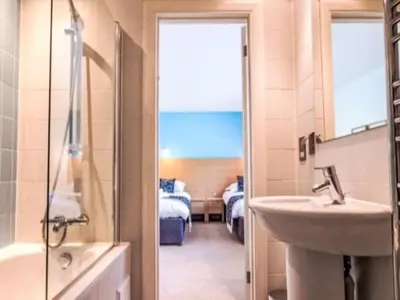 a bathroom with a sink and a shower and a sink at Holiday Home Haven by Interhome in Perranwell