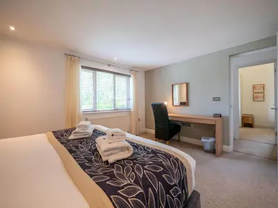 a hotel room with a bed with towels on it at Holiday Home Haven by Interhome in Perranwell