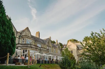 a large building with people standing outside of it at The Alverton in Truro