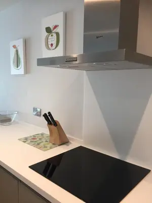 a kitchen counter with a knife block on it at Saltwater Suites at Fistral in Newquay