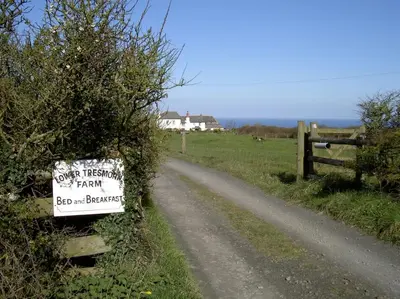 a sign on the side of a dirt road at Lower Tresmorn Farmhouse in Crackington Haven