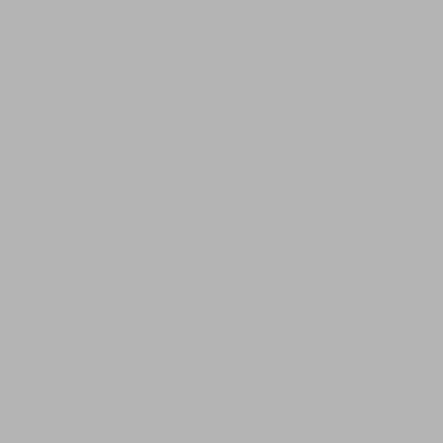 a white stone building on the side of a street at Beach Corner Cottage in Gorran Haven