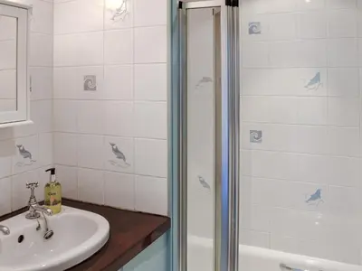 a bathroom with a sink and a shower at Sunnyside in Delabole