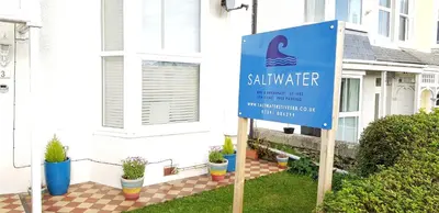 a sign in front of a house at Saltwater in St Ives