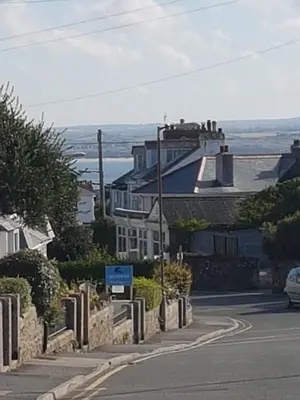 a house on the side of a road at Saltwater in St Ives