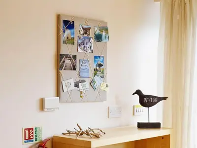 a room with a desk and a picture on the wall at Sunnyside Cottage in Crantock