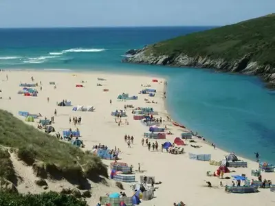 a group of people on a beach near the water at Sunnyside Cottage in Crantock