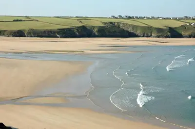 an aerial view of a beach with the ocean at Sunnyside Cottage in Crantock