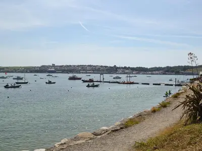 a large body of water with boats in it at Trelawny Court in Saint Minver