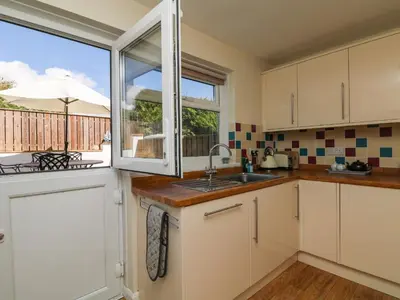 a kitchen with a sink and a window at Bayview in Newquay