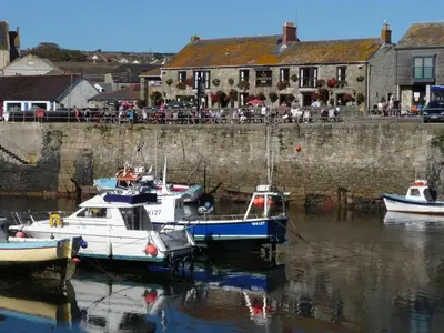 a group of boats docked in a body of water at Rosa Cottage in Porthleven