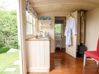 a kitchen in a tiny house with a sink at Orchard in Wadebridge