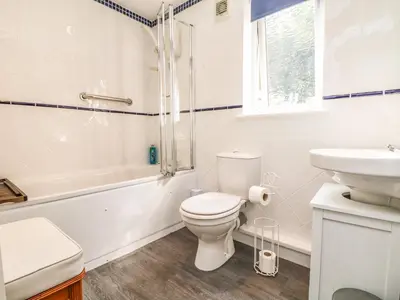 a bathroom with a toilet and a sink and a shower at Little Westwards in Penzance