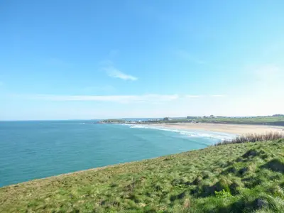 a view of a beach with the ocean in the background at Fistral Surf in Newquay