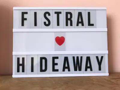 a white box with a heart on top at Fistral Hideaway in Newquay