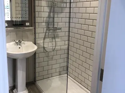 a bathroom with a sink and a shower at The Cornubia Inn in Hayle