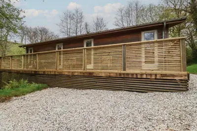a house constructed of wood on a pile of gravel at 2 Stonerush Valley in Looe