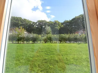 a window with a view of a yard at 6 Streamside in Looe