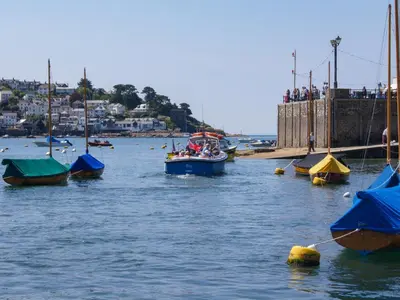 a group of boats in a body of water at The Shell Seekers in Fowey