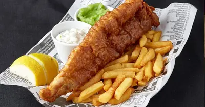 a fish stick with french fries and a lemon at The Cornishman Inn in Tintagel