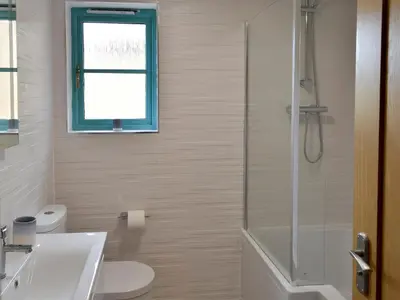 a bathroom with a shower and a toilet and a sink at Eagle Owl Lodge-Ukc3770 in Saint Columb Major