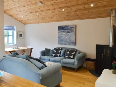 a living room with two couches and a table at Eagle Owl Lodge-Ukc3770 in Saint Columb Major