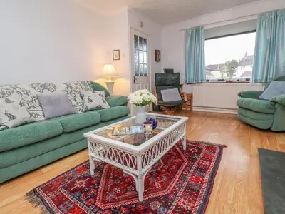 a living room with a couch and a coffee table at Phenests in Falmouth