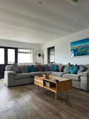a living room with a couch and a coffee table at Wheal Frances-Beautifully Fitted Bungalow Helston Cornwall in Helston