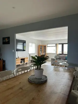 a living room with a table with a potted plant at Wheal Frances-Beautifully Fitted Bungalow Helston Cornwall in Helston