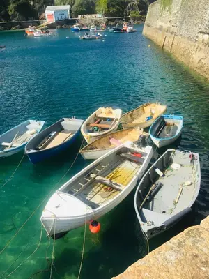 a group of boats tied to a dock in the water at Corner Cottage Mevagissey in Mevagissey