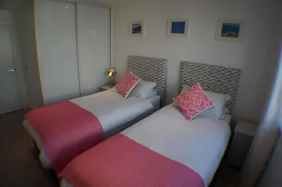 two beds sitting next to each other in a room at 29 @ One Lusty Glaze in Newquay