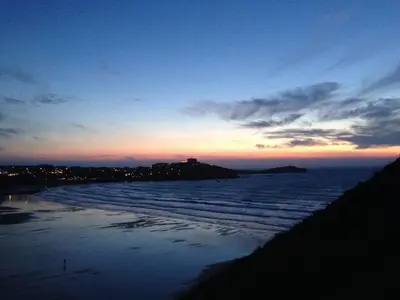 a view of the beach at sunset at 29 @ One Lusty Glaze in Newquay