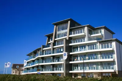 a large white building with a lot of windows at 29 @ One Lusty Glaze in Newquay