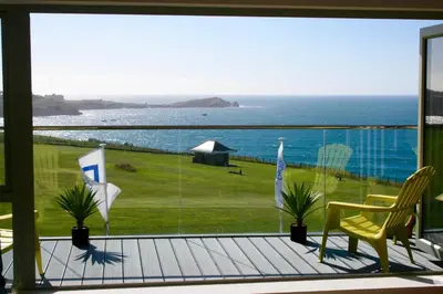 a balcony with a view of the ocean at 29 @ One Lusty Glaze in Newquay