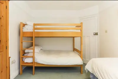 a bunk bed room with two bunk beds at Chy-an-Lowena in Crantock