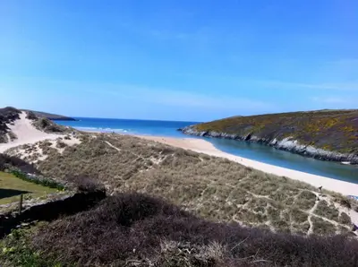 an aerial view of a beach with the ocean in the background at Chy-an-Lowena in Crantock