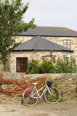 a bike parked in front of a stone building at The Roundhouse in Redruth