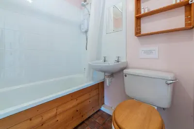 a bathroom with a toilet and a sink at 12 Westward Flats in Polzeath