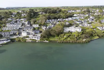 an aerial view of a small town by the water at Curlew's Cwtch in Wadebridge