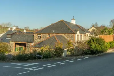 a brick house on the side of a road at Keepers Cottage in Wadebridge