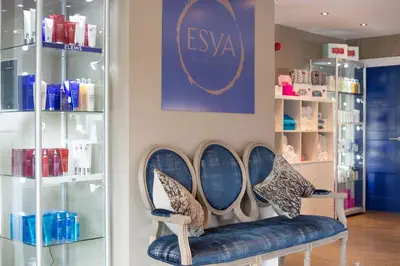 a store with a row of chairs with shoes on them at Retallack Resort by Away Resorts in Padstow